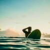 man on surfboard in ocean