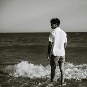 man on the beach water